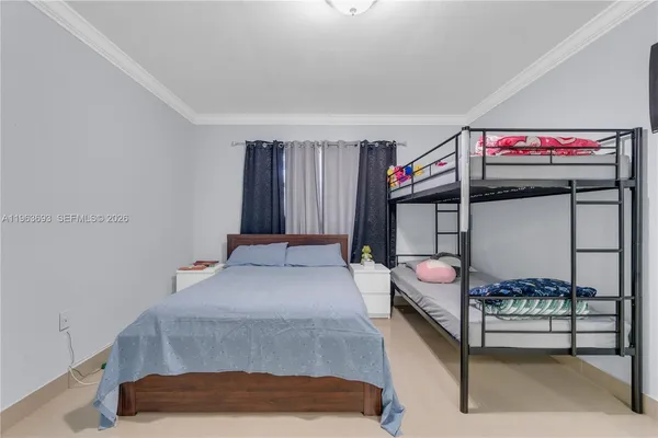 a bed room with a bed and a window