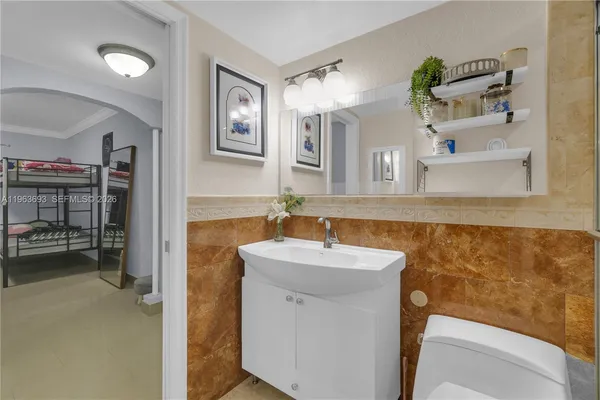 a living room with furniture and large windows