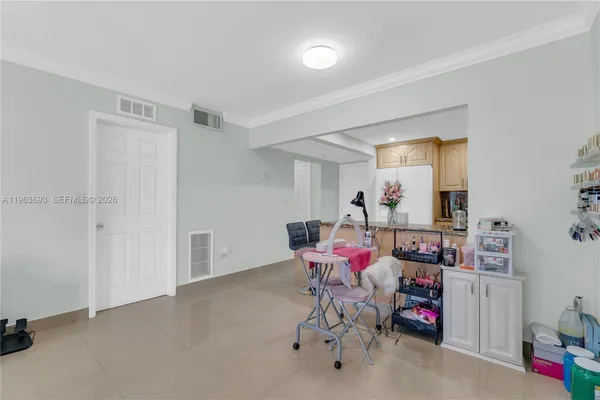 a kitchen with kitchen island cabinets and window