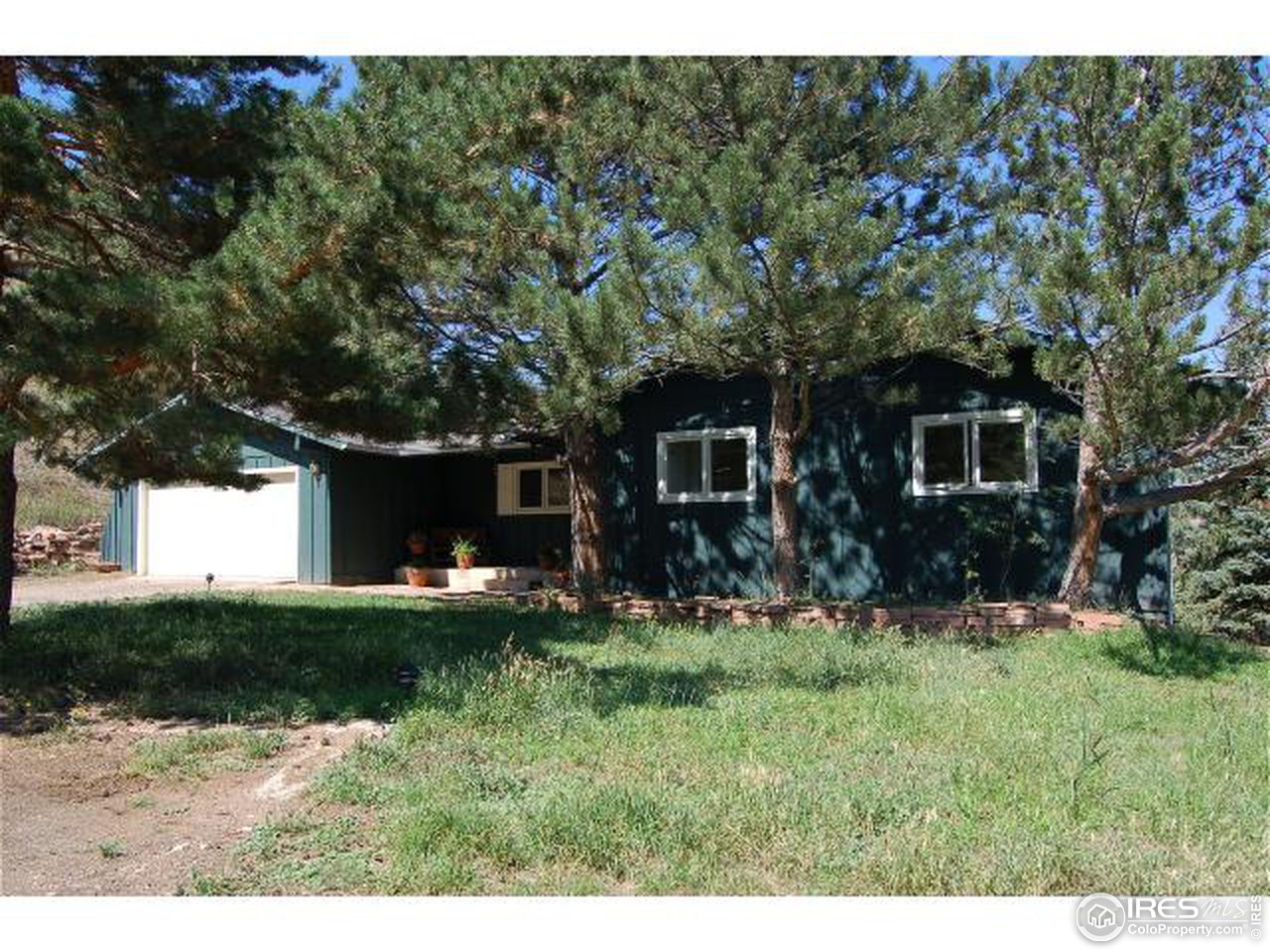 7229 Olde Stage Road Boulder, CO 80302 - Photo 1 of 8 a view of a house with a yard