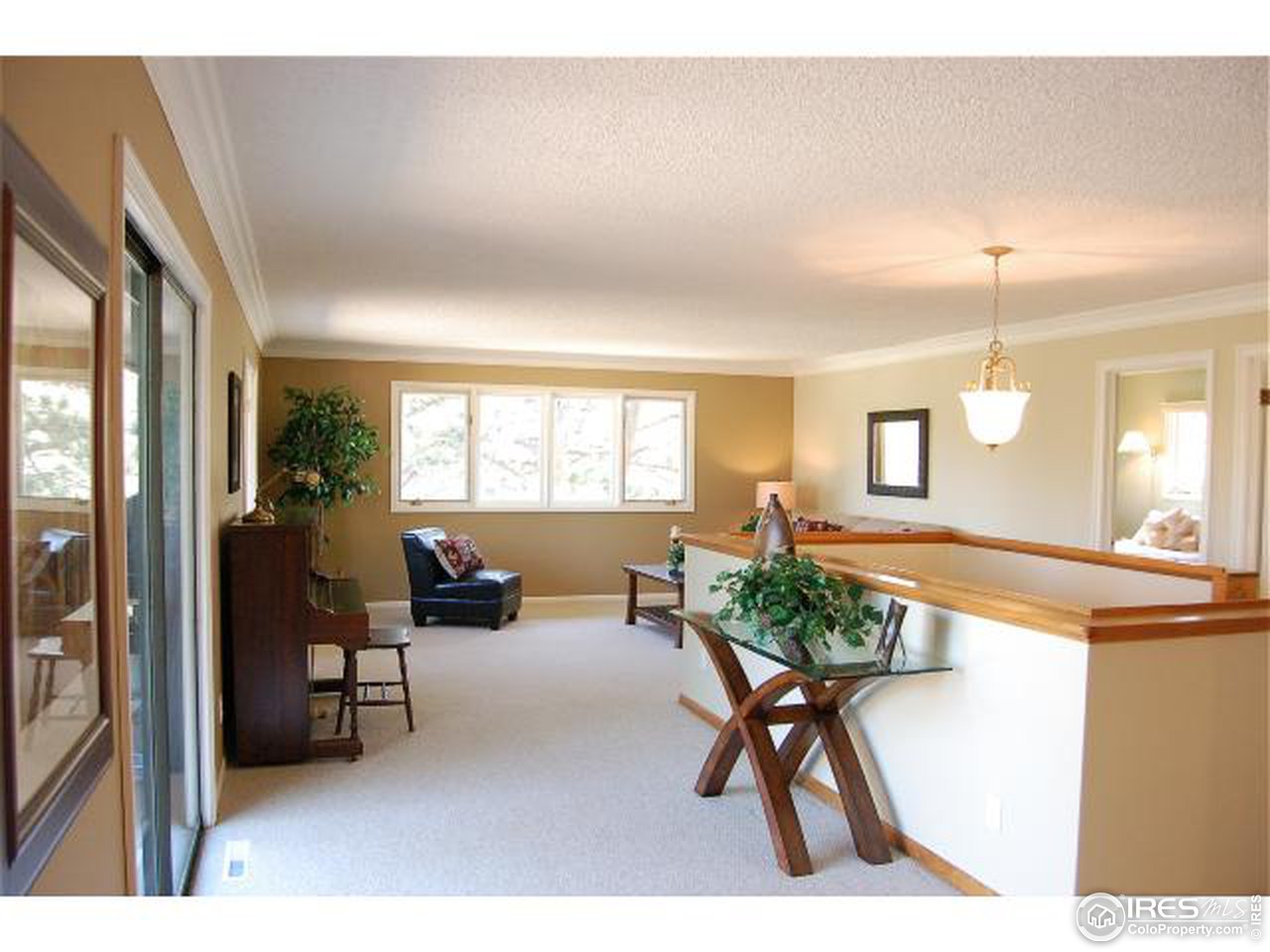 7229 Olde Stage Road Boulder, CO 80302 - Photo 2 of 8 a living room with furniture a window and a table