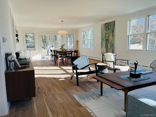 a bedroom with furniture and a window