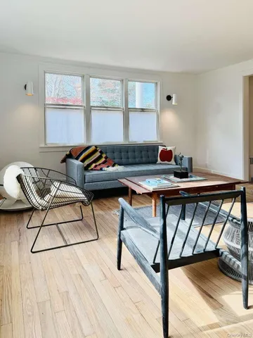 a room view with wooden floor and staircase