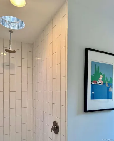 a spacious bathroom with a double vanity sink bathtub and window