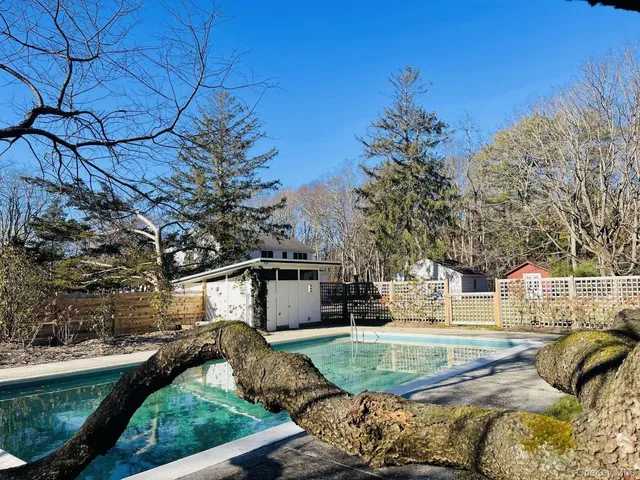 a view of a swimming pool with a patio
