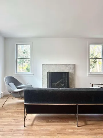 a view of a livingroom with furniture and a window