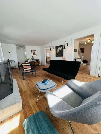 a bathroom with a toilet a sink and a window