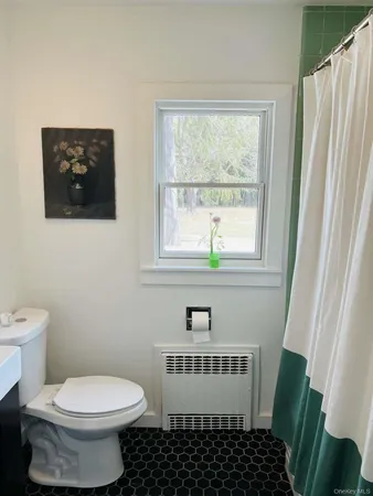 a view of a storage & utility room with washer and dryer