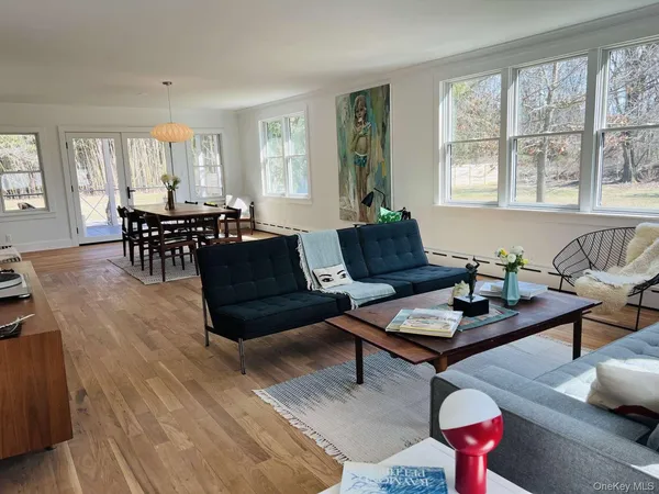 a spacious bedroom with a bed and a desk
