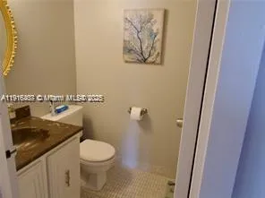 a bathroom with a toilet and a sink