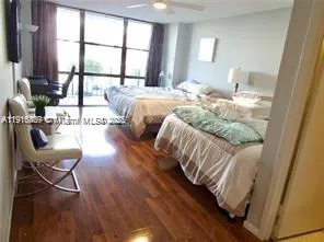 a bedroom with furniture and a window