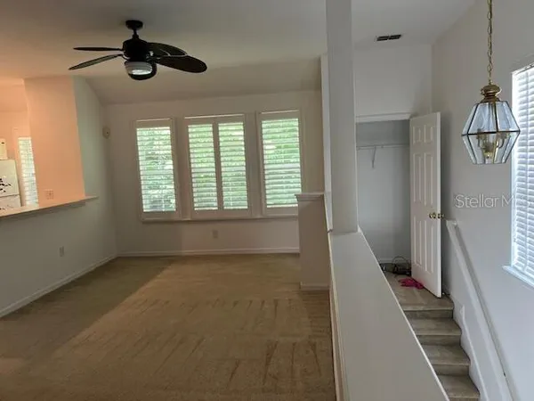 a view of an empty room with a window