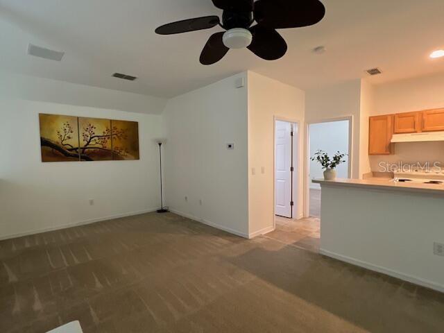 947 Spring Park Loop, Unit B Kissimmee, FL 34747 - Photo 6 of 10 a view of an empty room with window and cabinet