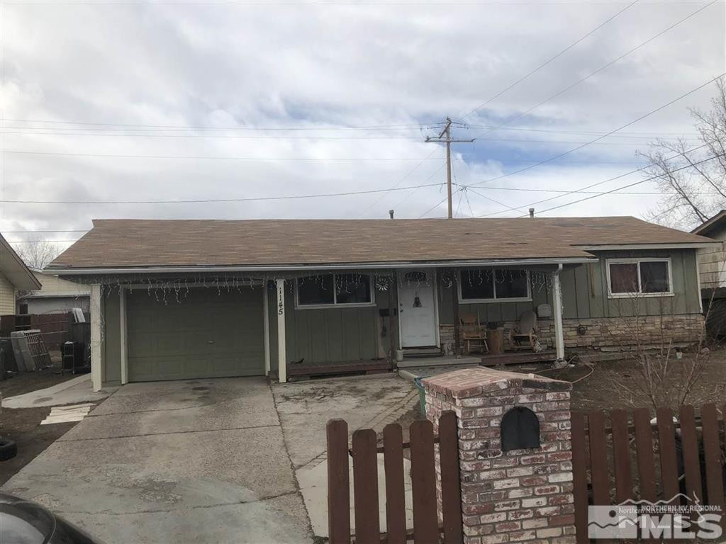 1145 Butler Street Reno, NV 89512 - Photo 1 of 1 a front view of a house with yard