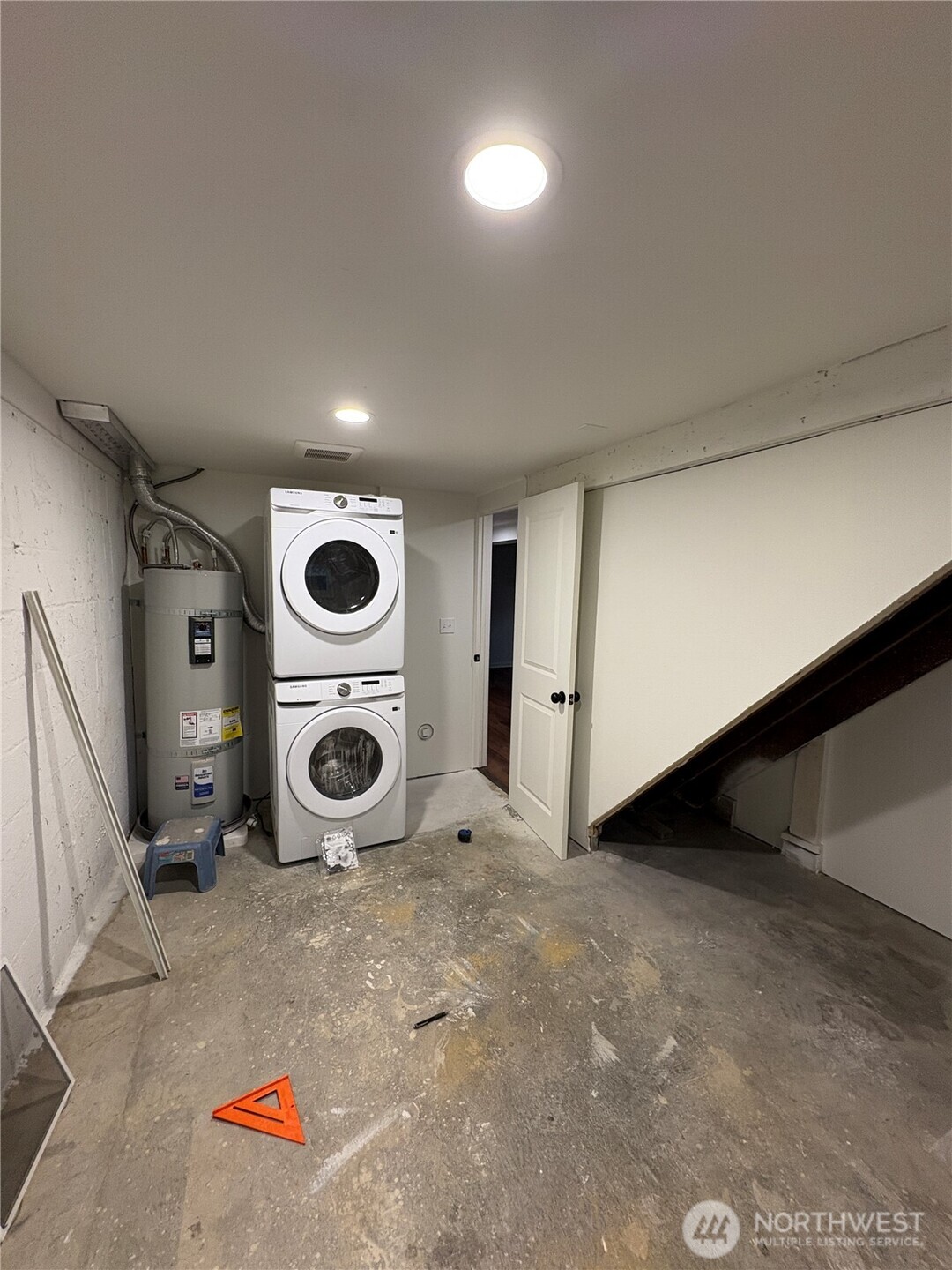 840 Northwest 54th Street Seattle, WA 98107 - Photo 16 of 18 an empty room with water heater and storage