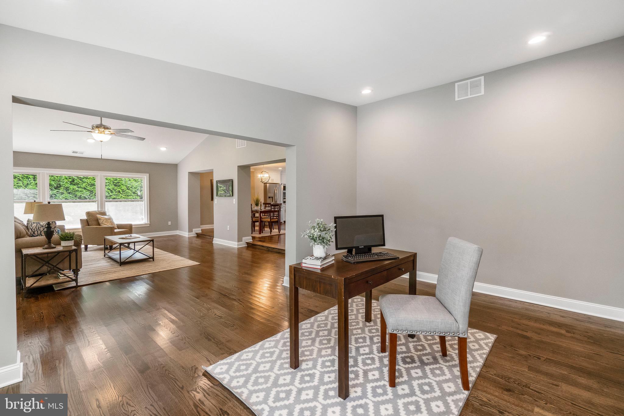 1309 Denby Road Baltimore, MD 21286 - Photo 22 of 49 a living room with furniture and a wooden floor