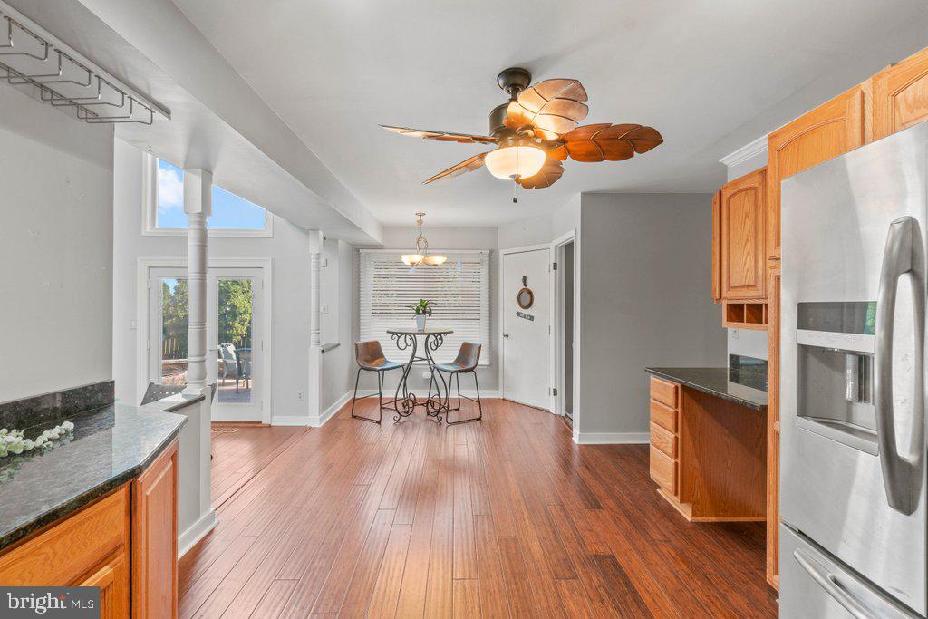 4426 Camellia Road Baltimore, MD 21236 - Photo 16 of 51 a view of a dining room with furniture and wooden floor