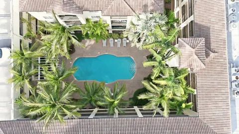 a vase of flowers sitting on a floor