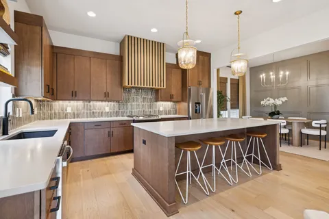 a kitchen with a sink and a refrigerator
