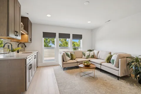 a view of a balcony with wooden floor