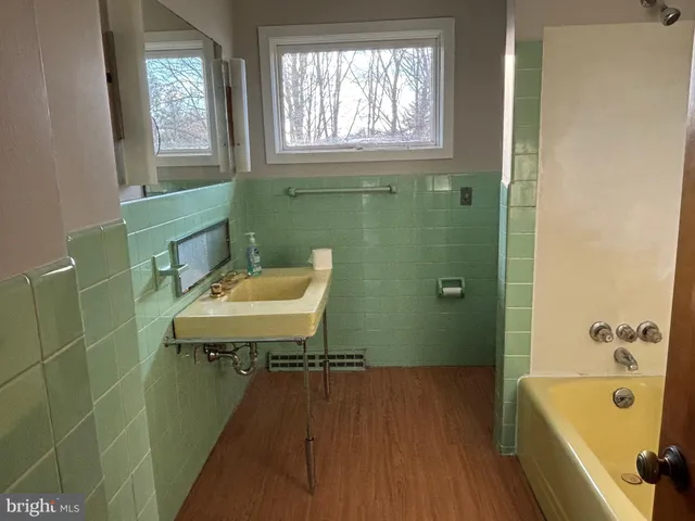 a bathroom with a sink a toilet and a bathtub