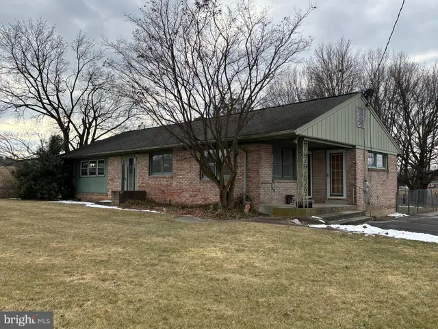 a house with trees in the background