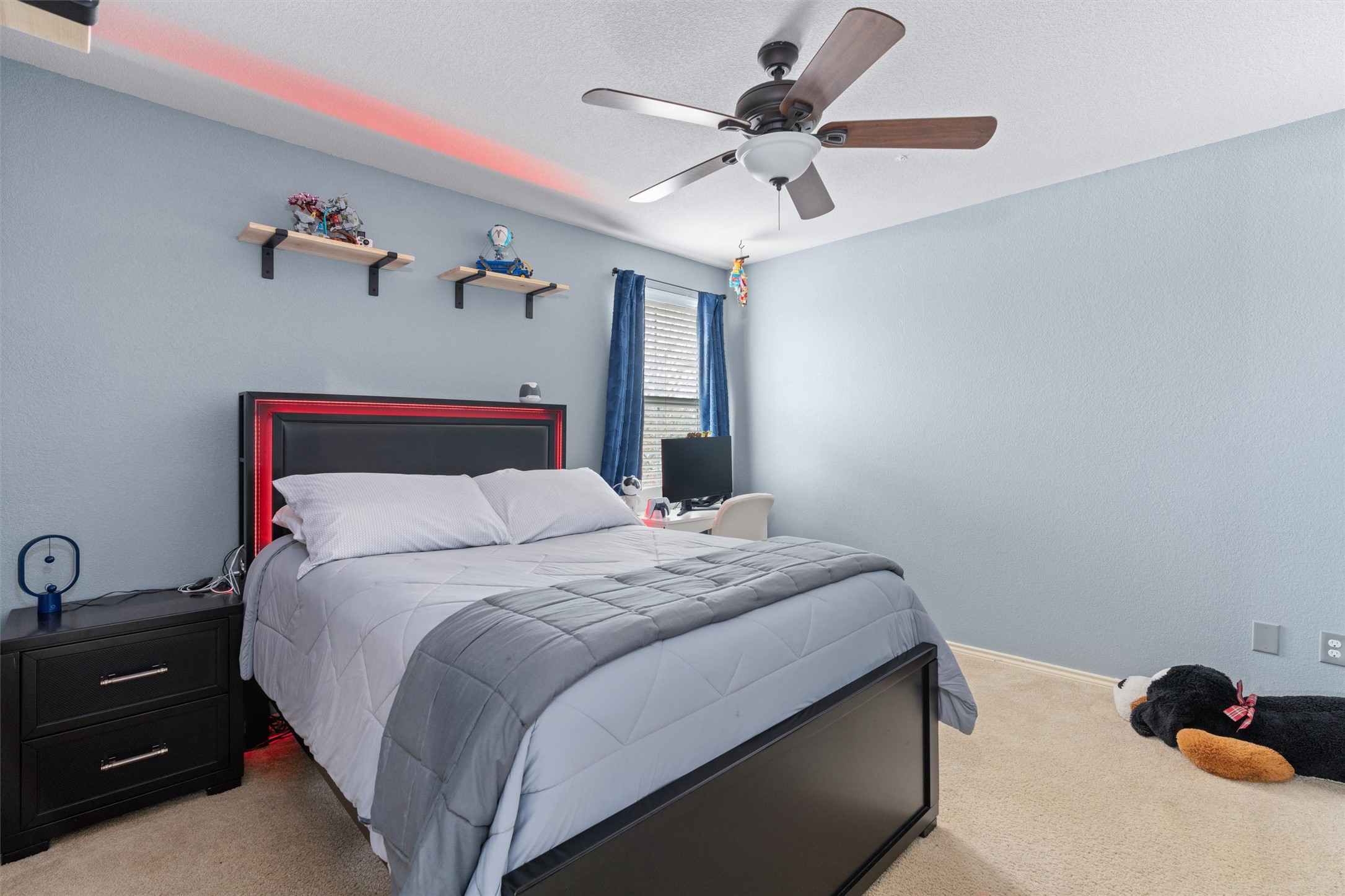 338 Altamont Street Hutto, TX 78634 - Photo 22 of 40 Bedroom with light carpet and a ceiling fan