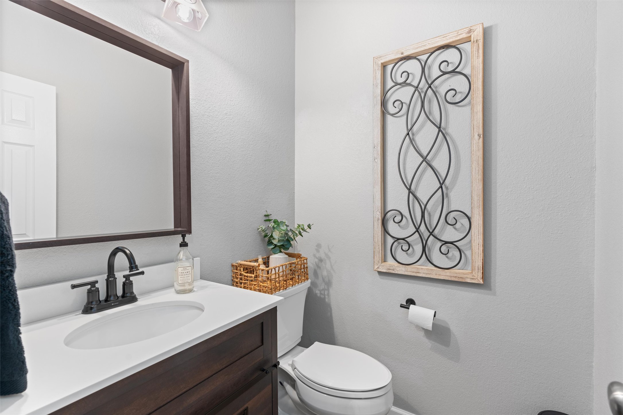 338 Altamont Street Hutto, TX 78634 - Photo 4 of 40 Bathroom with vanity and a textured wall