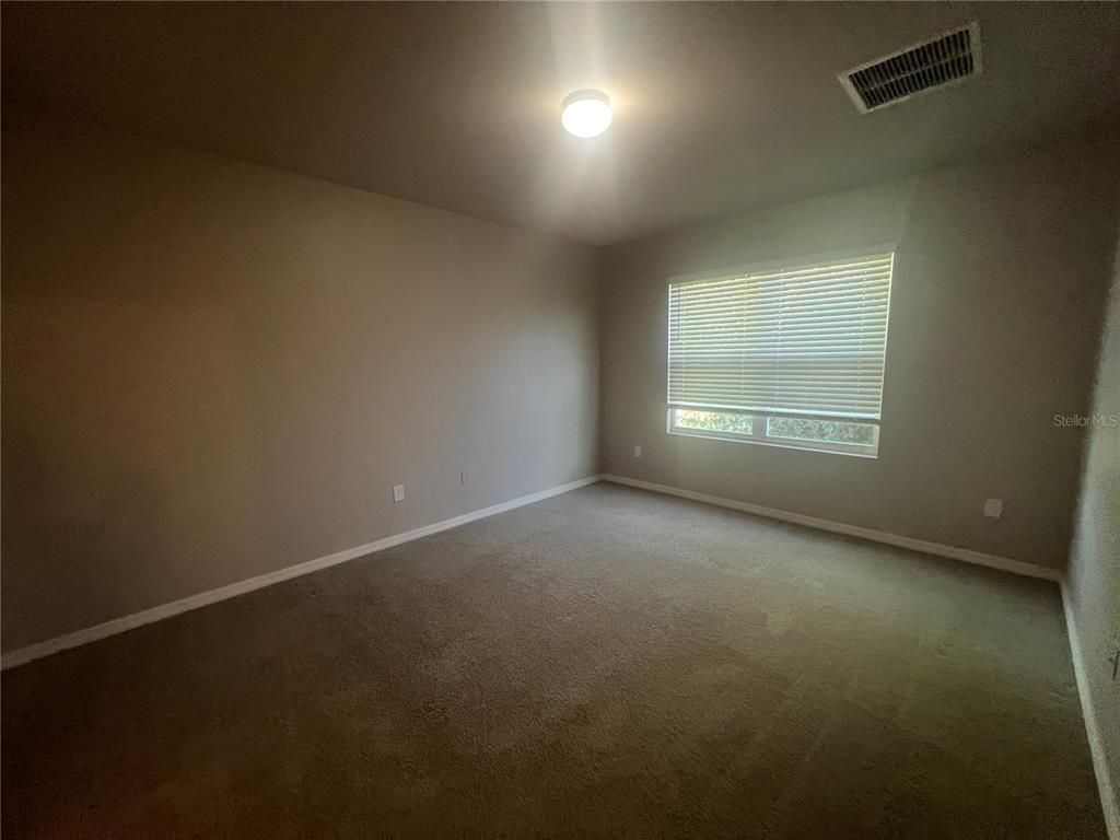 280 Perute Court Punta Gorda, FL 33983 - Photo 24 of 31 an empty room with a empty space and windows