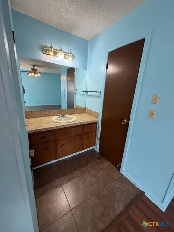 a bathroom with a sink and mirror