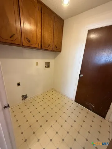a bedroom with a bed and cabinets