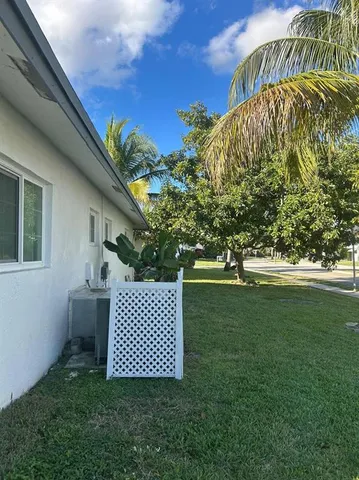 a view of a door and chair in the yard
