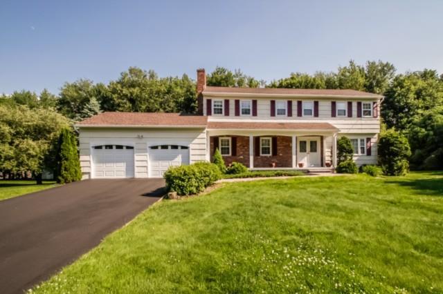 12 Firehouse Road Trumbull, CT 06611 - Photo 1 of 1 a front view of a house with a garden