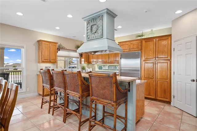 a dining area with furniture and a kitchen