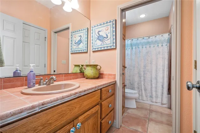 a bathroom with a sink a mirror and a shower