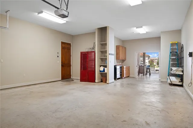 an empty room with furniture and a ceiling fan
