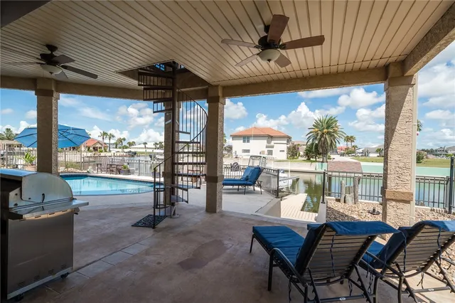 a dining room with furniture and a floor to ceiling window