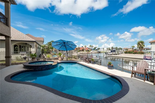 a view of a swimming pool with a patio