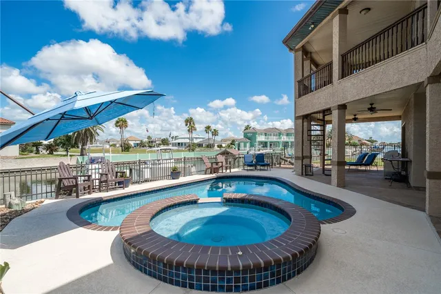 a view of a swimming pool with a patio