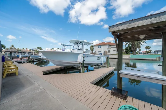 a roof deck with table and chairs a barbeque