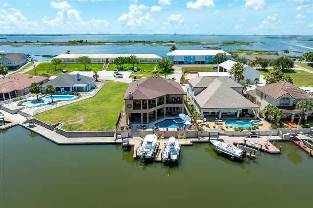 a view of a swimming pool and lounge chairs
