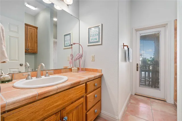 a bathroom with a sink double vanity and a mirror