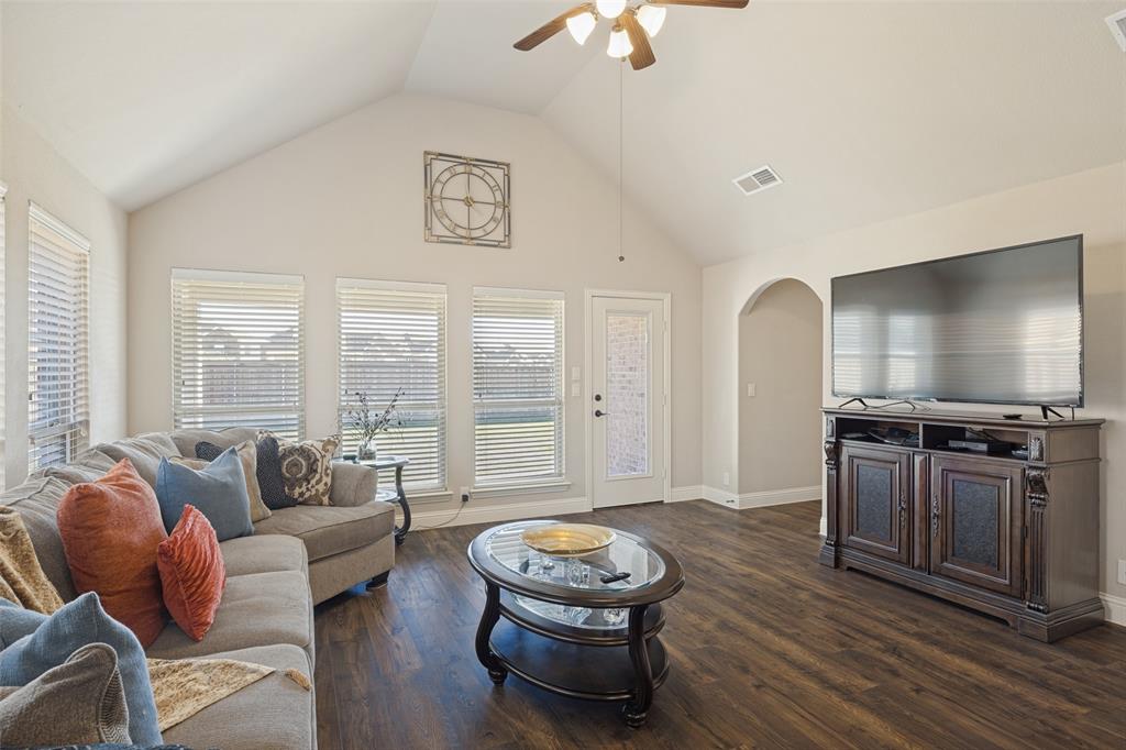3405 Fletcher Road Heartland, TX 75114 - Photo 5 of 30 Another view of living area with ceiling fan, high ceilings, and beautiful Laminate flooring.