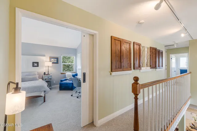 a bedroom with a bed and furniture