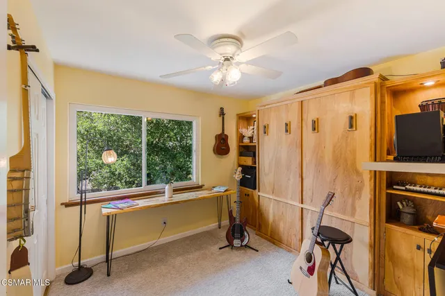 a view of a patio with chairs and a table