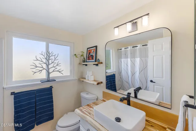 a view of a patio with table and chairs and potted plants