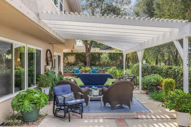 a view of a backyard with sitting area
