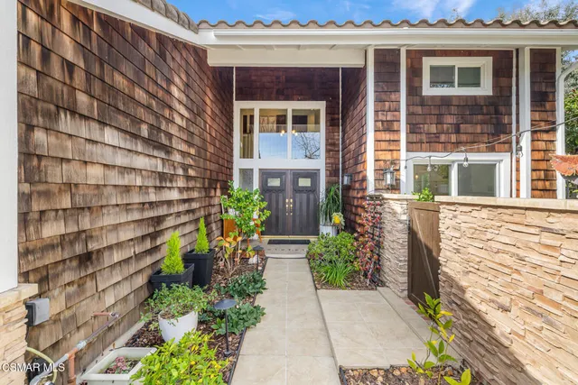 a kitchen with a stove a sink and a refrigerator