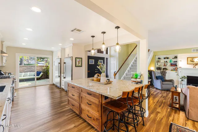 a view of a kitchen counter space and wooden floor