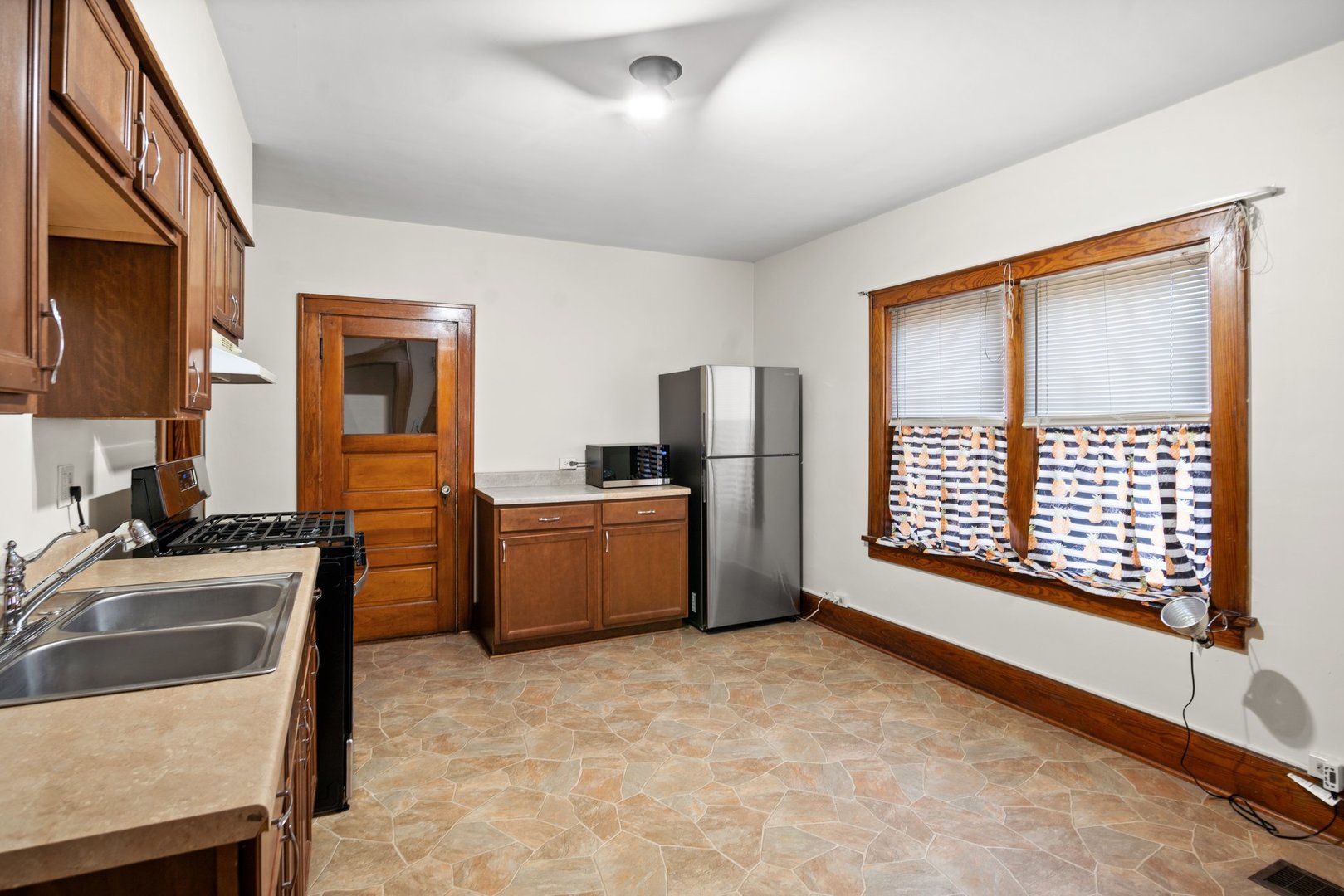 803 South 3rd Street, Unit 1 St. Charles, IL 60174 - Photo 7 of 16 a view of a kitchen with furniture and large windows